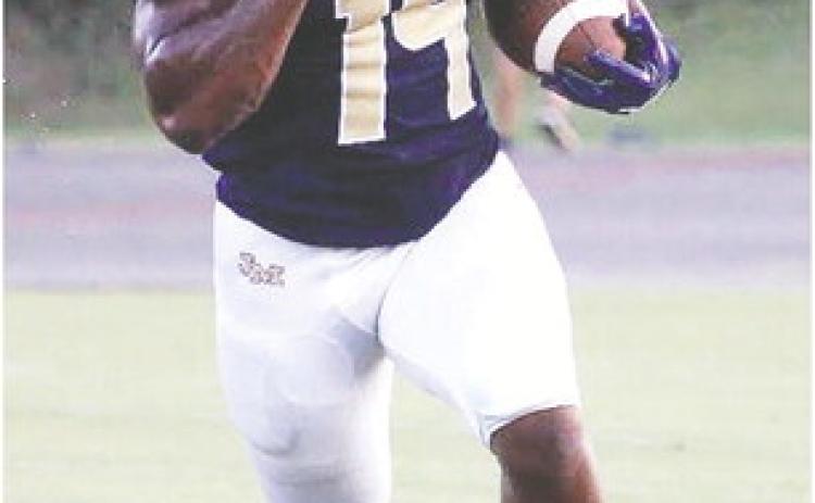 Javian Butts (14) bursts into open field after hauling in a pass from quarterback Kolt McMichael. TREY NORRIS/Staff