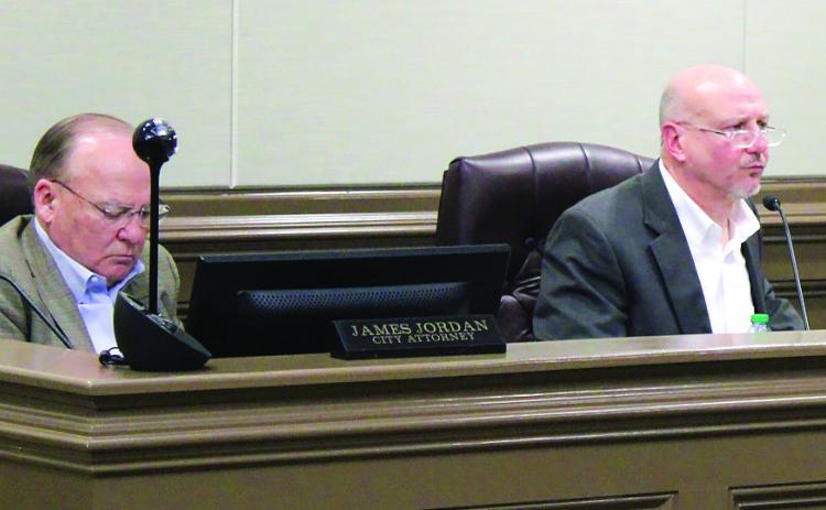 Milledgeville attorney James Jordan (left) listens as City Manager Hank Griffeth (right) provided his report on redistricting projects based on a decrease in Baldwin County’s population in the 2020 Census. SKYLA MORRIS/Staff