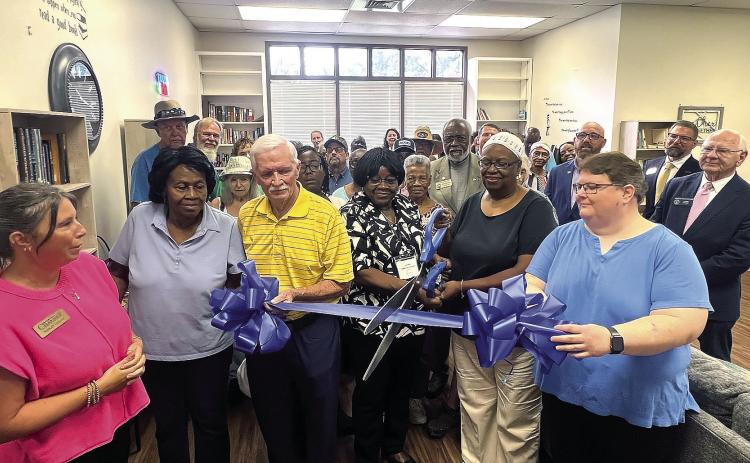 Local seniors, Overview staff, and elected officials gathered to cut the ribbon to the new Senior Center library that will give access to hundreds of books alongside other adavancements to the center. CONTRIBUTED