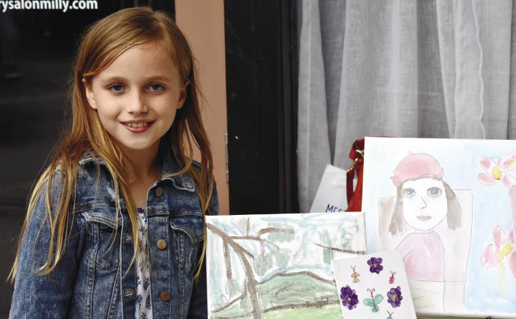 Parker of Parker’s Art and Things sold original watercolor, acrylic, and special drawing art at the Kids’ Market.