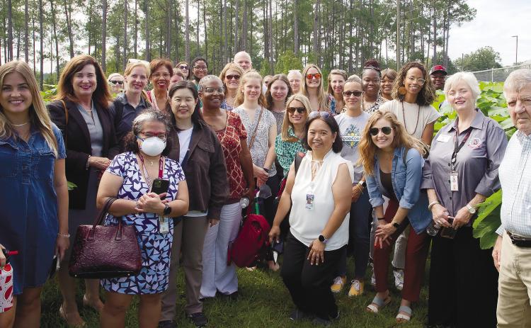 The Georgia Farm-to-School alliance poses in front of a Baldwin County garden. CONTRIBUTED