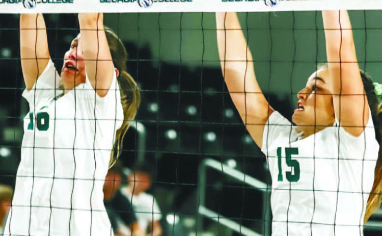 Brooke Roberts (left) and Callie Miller go up for the block. COURTESY OF GC ATHLETICS