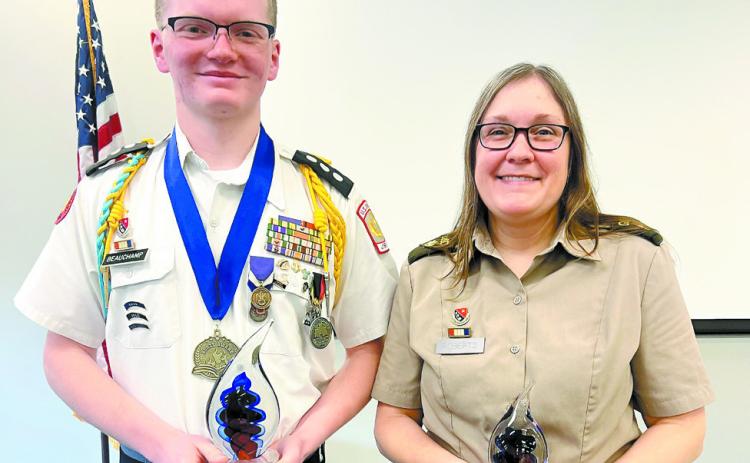 Liam Beauchamp stands with his chosen educator, Major Stephanie Roberts, that left a profound impact on his educational journey. COURTESY OF GMC