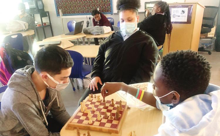 Oak Hill Middle School students use chess to strengthen critical thinking skills and communication skills. CONTRIBUTED
