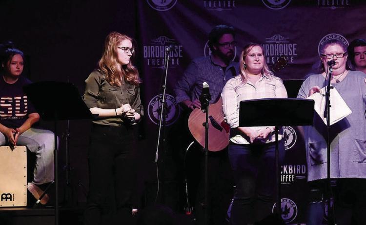Professor Laurie Peebles and Dr. Stephanie Jett, front center, speak to the audience Tuesday night at the “Sights and Sounds” performance. SAVANNAH GREENE/COURTESY OF GCSU