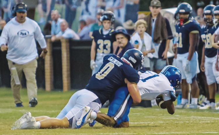 Linebacker Abe Gainous makes one of the seven total tackles he had vs. Brookstone last Friday in Milledgeville. TREY NORRIS/Staff