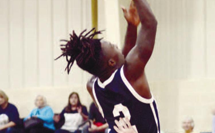Bud Veal (2) goes up and over defenders for an easy layup. IAN TOCHER/Staff