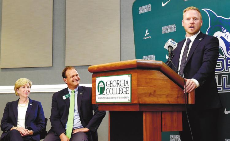 School President Cathy Cox (left) and Athletics Director Wendell Staton (center) look on as Jack Marchant delivers his first words as the Head Coach of GC Soccer. CONTRIBUTED