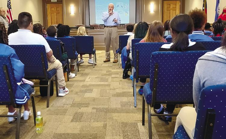 In December, City Manager Hank Griffeth led ambassadors through a class at the Milledgeville City Hall. CONTRIBUTED