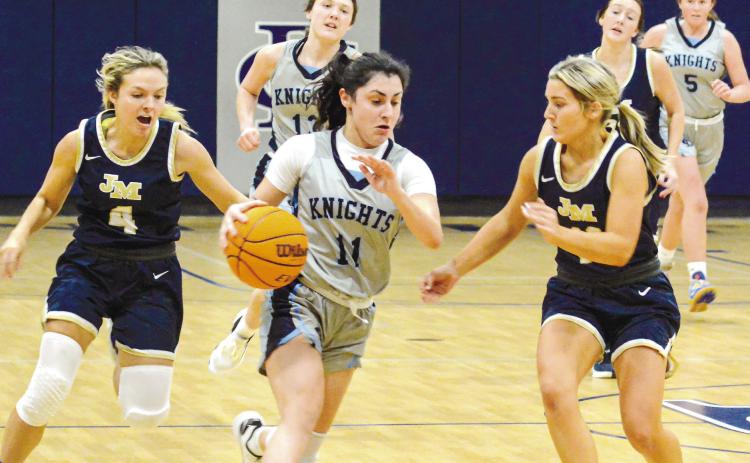 A pair of Lady Trojans guard a Bethlehem Christian player in transition during a win in January. LANCE MCCURLEY/Staff