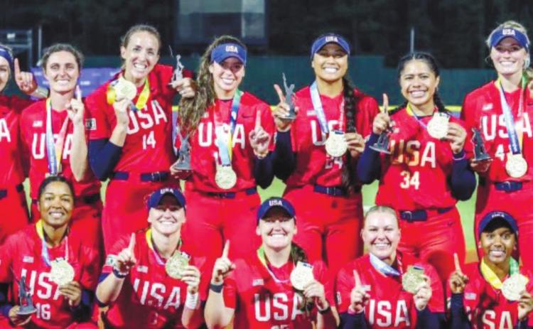 USA softball staff and team members claim their first place medals after taking down Japan. CONTRIBUTED