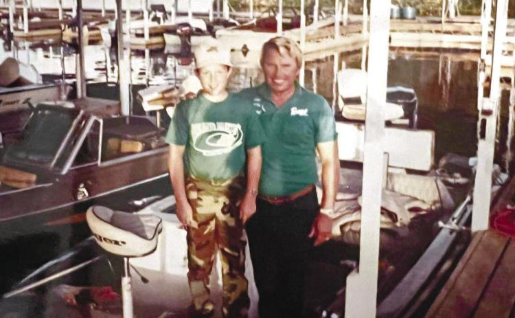 A young James Pressley with fishing legend Roland Martin in Martin’s boat on Lake Okechobee during the 1980s. CONTRIBUTED