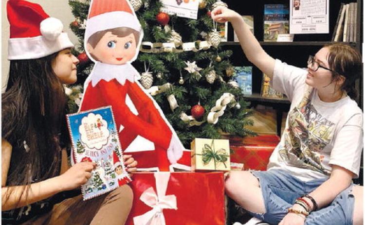 Tess Owen (left) and Julie Blizzard examine gifts available at the GWM bookstore. CONTRIBUTED
