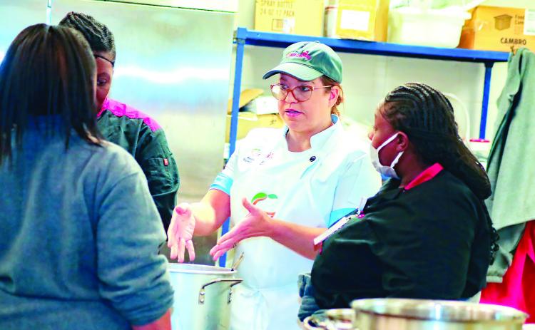 Georgia Department of Education Chef Rachel Petraglia speaks to Baldwin County nutrition specialists about seasoning. ERIC JONES/Contributed