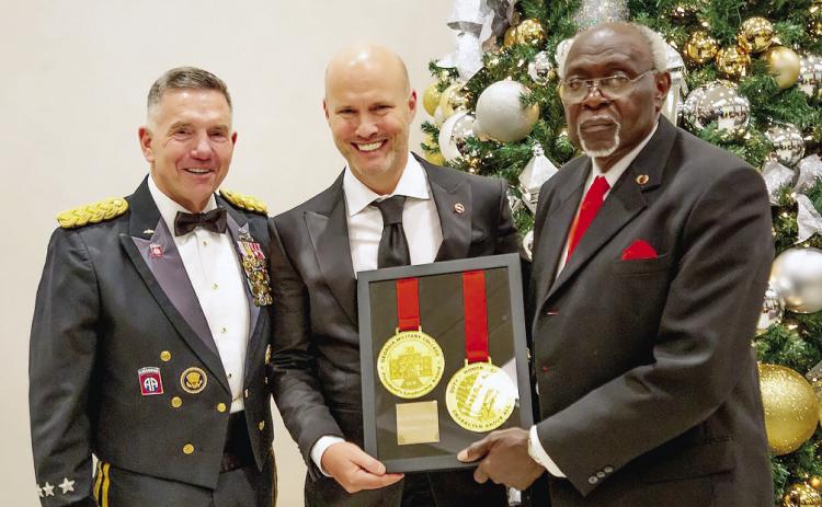 L-R: Georgia Military College President Lieutenant General William B. Caldwell IV, USA (Ret), awardee Rob Posner, and Chairman of the GMC Board of Trustees George Hogan. COURTESY GMC