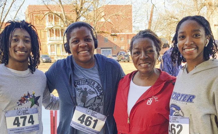 From left, Jamariyuh Chandler, Aymi Rosado, Dr. Runee Sallad, and Lanika Ross are all smiles after running in the 5K. LYNN HOBBS/Staff