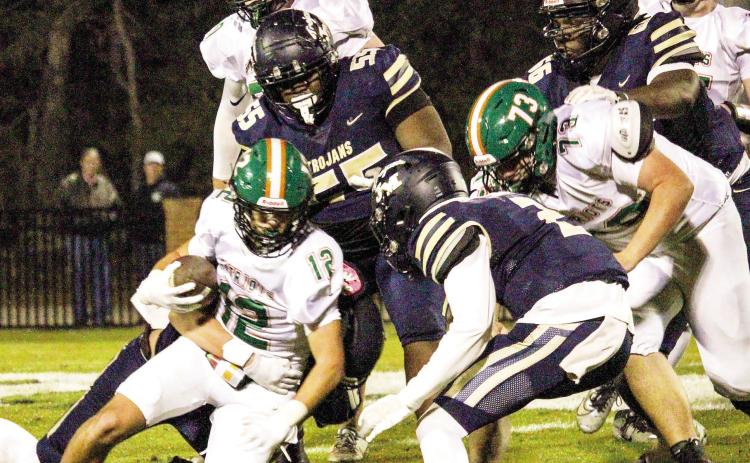 JMA defenders bring down a Pinewood ball-carrier. TREY NORRIS/Staff