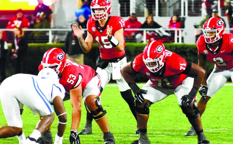 Carson Beck (15) ready to receive a snap in the first quarter of the Kentucky game. Beck threw for over 300 yards in the first half alone. BRENDAN KOERNER/Staff
