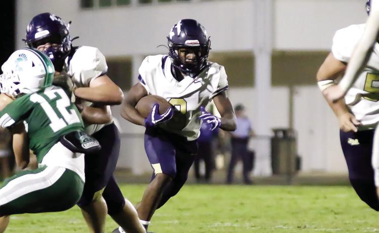 Junior running back Jamel Cooper (center) scored two rushing touchdowns against First Presbyterian Day last Friday and led his team with an impressive 167 yards on 17 carries. TREY NORRIS/Staff