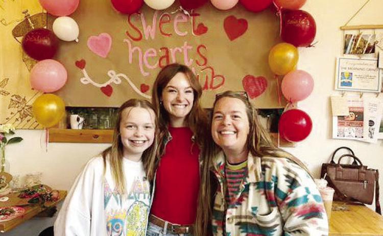 Co-owner of Morning Grind, Bridgette Smith (middle), poses with customers Lillian (left) and Laurel Marott.. CONTRIBUTED