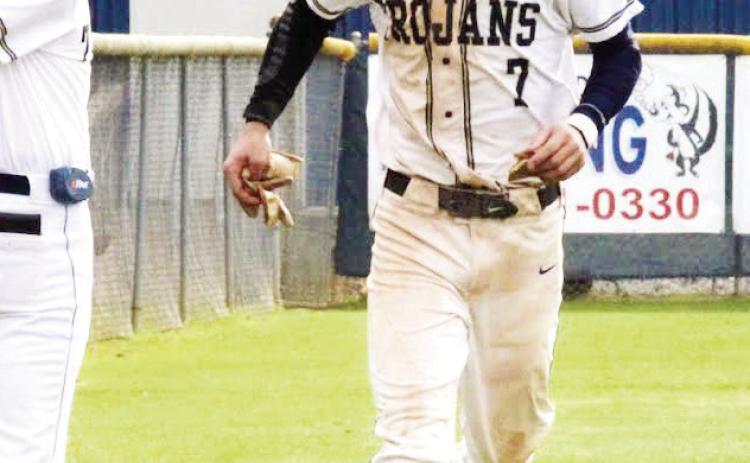 Cooper Wilburn (7), who had a big game Monday night at home against Tatnall Square, gets waved through by JMA head coach Chad Starley. TREY NORRIS/Staff