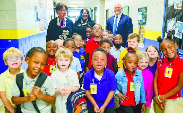 Midway Hills Primary students pose with Baldwin County School District faculty to celebrate their first day back. ERIC JONES/Contributed