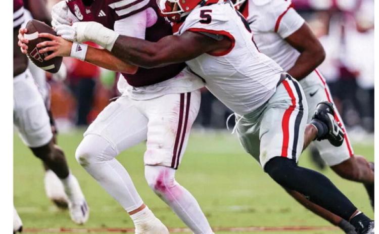 Georgia inside linebacker Raylen Wilson (5) tackles Mississippi State quarterback Blake Shapen during a game in Starkville last season. LANCE McCURLEY/Staff