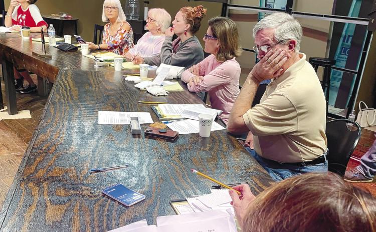 Actors ponder their lines as they rehearse together and prepare for the Nov. 9 opening of 12 Angry Jurors at The Plaza Arts Center. CONTRIBUTED