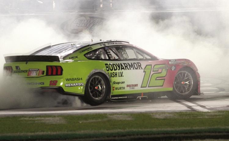 Ryan Blaney touches off an early-morning celebration following his dominant win at Echopark Speedway in Hampton.