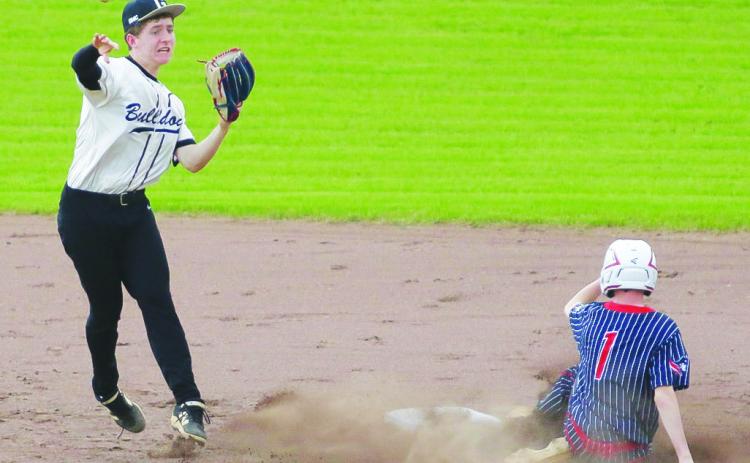 Sophomore second baseman Riley Marcott successfully turns a double play vs. GSIC in Milledgeville last Wednesday. TREY NORRIS/Staff