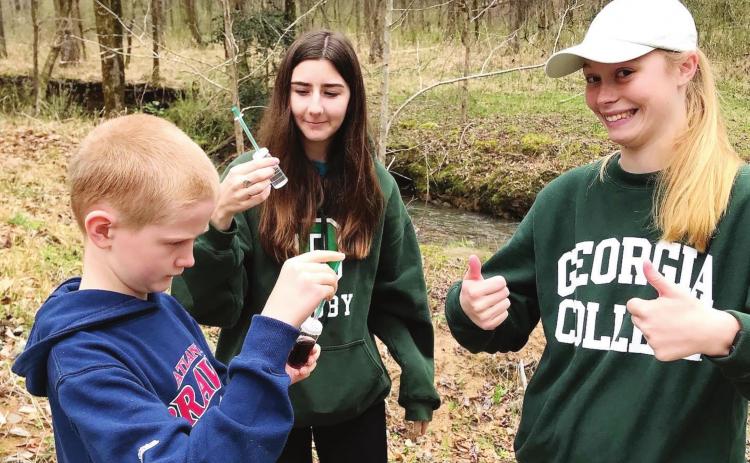 GC Academic Outreach offers monthly Adopt-a-Stream Chemical monitoring events at Champion Creek (Lake Laurel) and Tobler Creek (Andalusia). (l to r: Ben, Abby (Early Childhood Education) and Lillian (Special Education). CONTRIBUTED