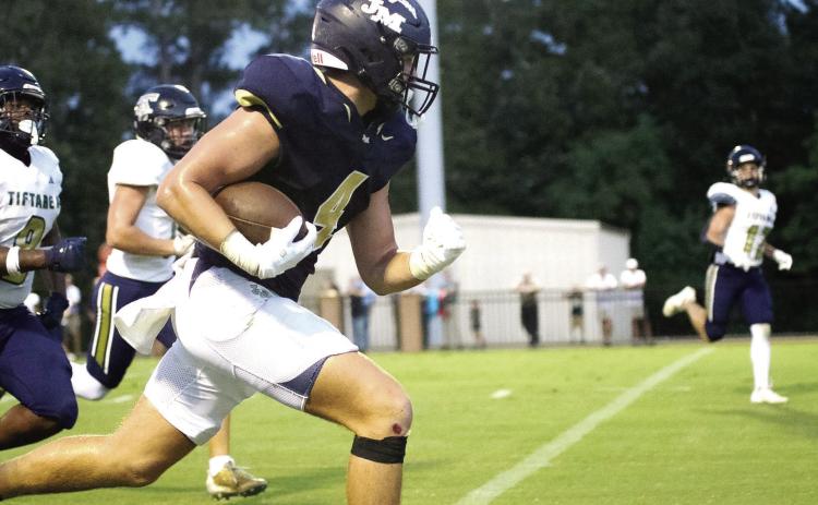 JMA’s Asa Wall (4) rushes the ball in a game against Tiftarea earlier this season. TREY NORRIS/Staff