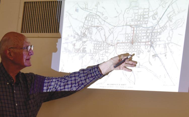 Railroad historian Charlie Brown shows the audience, with a laser pointer, where the first spike of the Dummy Line Railway was nailed. The red line on the map is the Dummy Line and the red dot on the map shows were the spike was nailed.