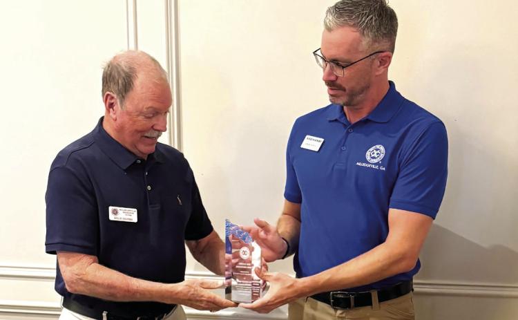 District President-Elect and Milledgeville club member Jeff Wells (right) presented Billy Griner, the only remaining charter member still active in the Exchange Club of Milledgeville, with a special recognition. CONTRIBUTED