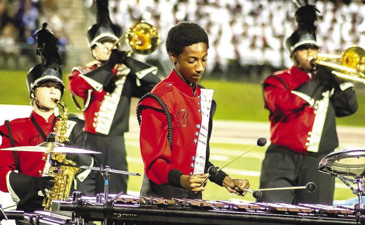 The Baldwin High School marching band performs on the football field. CONTRIBUTED