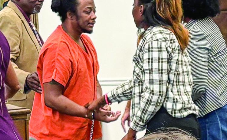 Jeremy Butts speaks with sister Cierra Butts following his Sept. 12 sentencing. DEBBIE LURIE-SMITH/Staff