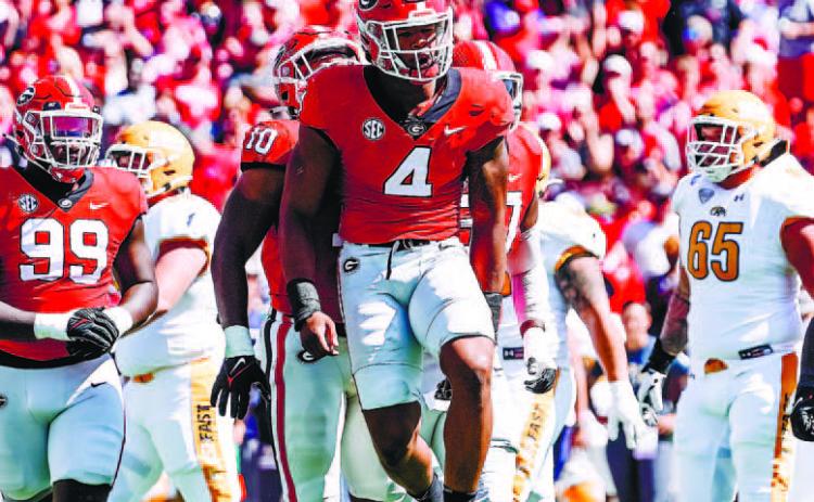 Senior linebacker Nolan Smith (4) and company will welcome the Auburn Tigers into Sanford Stadium Saturday at 3:30 p.m. JACK OZMER/UGA Athletics