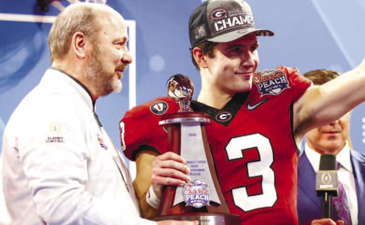 Georgia quarterback Stetson Bennett (13) was resilient after a tough start against Ohio State. On Georgia’s last two drives of the game, Bennett completed 5-of-5 passes for 148 yards and two TDs. He also passed for 190 yards in the fourth quarter. TONY WALSH/UGA Athletics