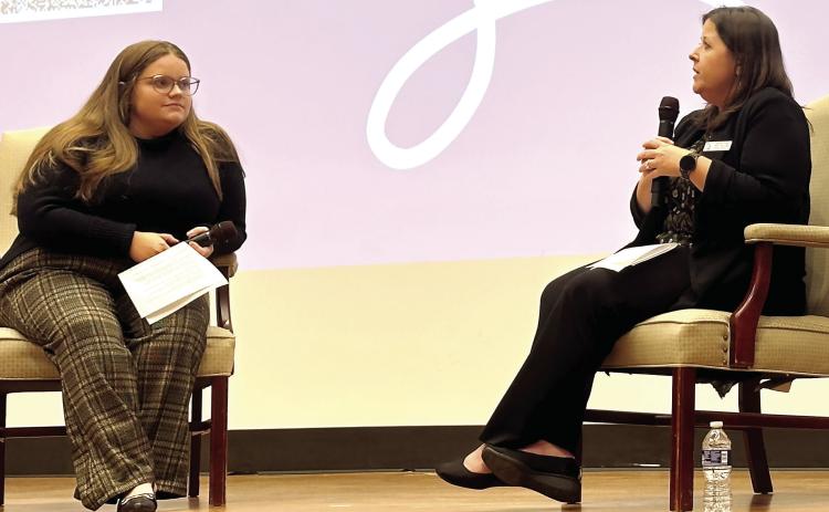 Georgia College senior Chloe Crosby (left) and Georgia Deputy State Auditor Kristina Turner on stage for the presentation titled “Beyond the Bottom Line: Building Resilience through Purposeful Leadership.” ALIVIA BLANTON/Staff