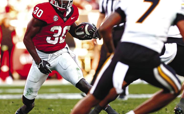 Daijun Edwards (30) rushed for 77 yards on 16 attempts last week in Georgia’s win over Missouri. TONY WALSH/UGA Athletics