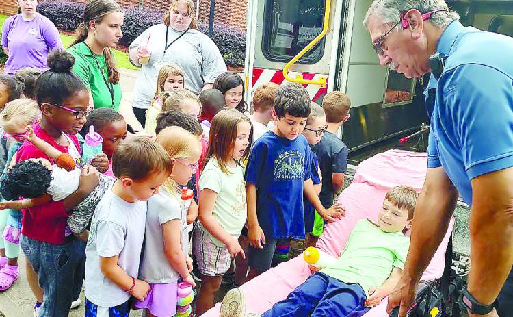 During June’s Hometown Heroes summer camp week, campers were visited by Baldwin County’s Emergency Medical Services and learned about their duties, the ambulance, and were given demonstrations of how the stretcher and vehicle worked. CONTRIBUTED