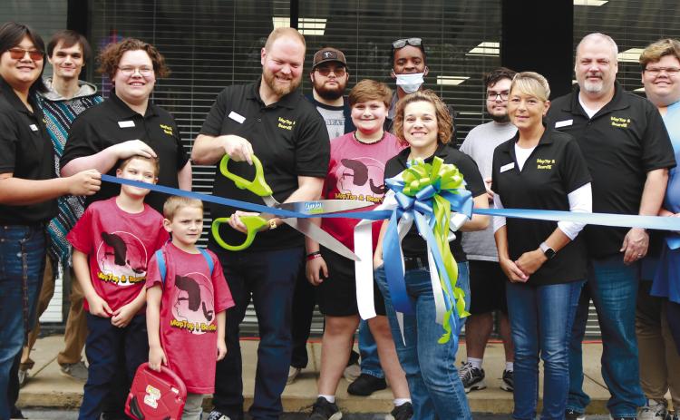 Mop Top &amp; Beardie doing their ribbon cutting ceremony with the Chamber of Commerce on April 9.