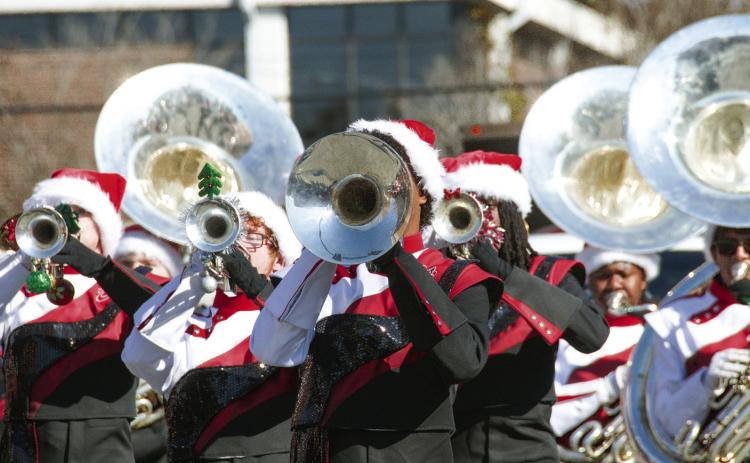 The Baldwin Braves showed off school spirit as they marched down the street with their banner and were followed shortly by the music of Baldwin High School’s band.
