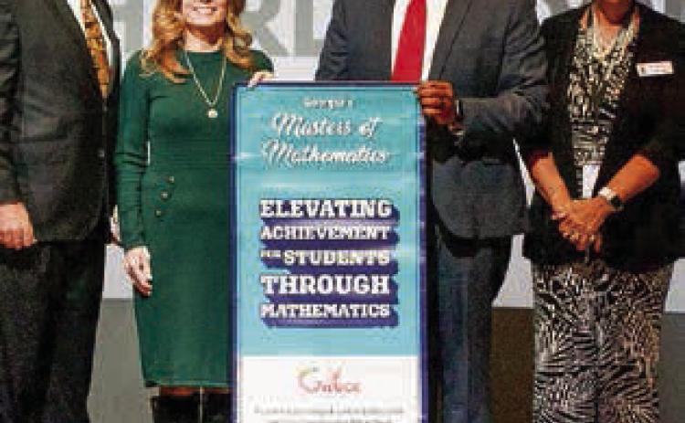 State Superintendent Richard Woods (left) visited schools throughout the state to give awards based on exceptional growth and achievment. Oak Hill Middle School received Georgia’s Masters of Mathematics Award, and OHMS was named as a Math Leader. CONTRIBUTED