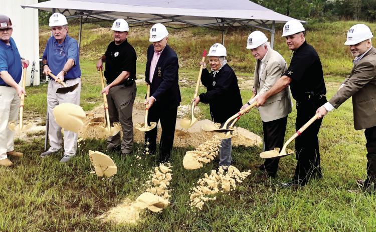L-R: Matt Bentley, Neil Dyer of Dyer Construciton, BCSO Maj. Brad King, Sheriff Bill Massee, Commissioner Emily Davis, Commissioner Henry Craig, BCSO Maj. Scott Deason and County Manager Carlos Tobar toss the first shovel of dirt. GREENBERRY MOORE/Staff