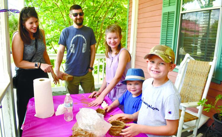 The Dempster family works together to create coil pots and bowls.