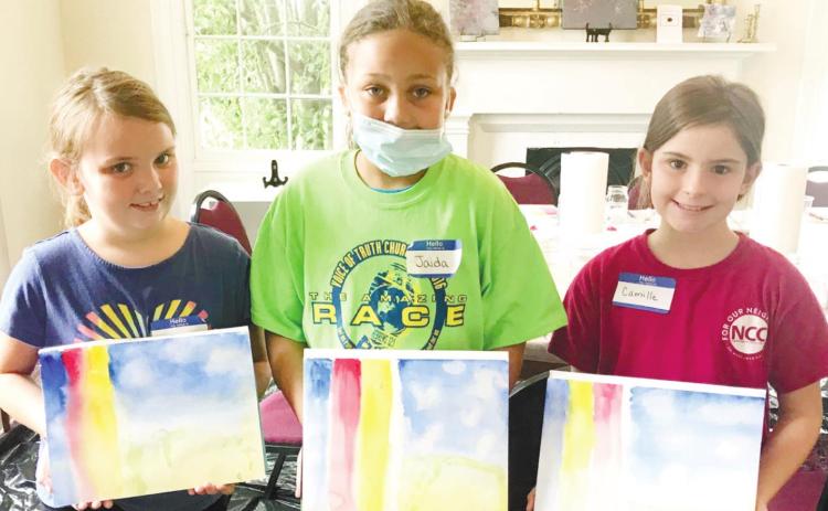 Participants in the Watercolor Camp show off the paintings they made with instruction from Dr. Audrey Crumbley. JOEL WHITE/Staff