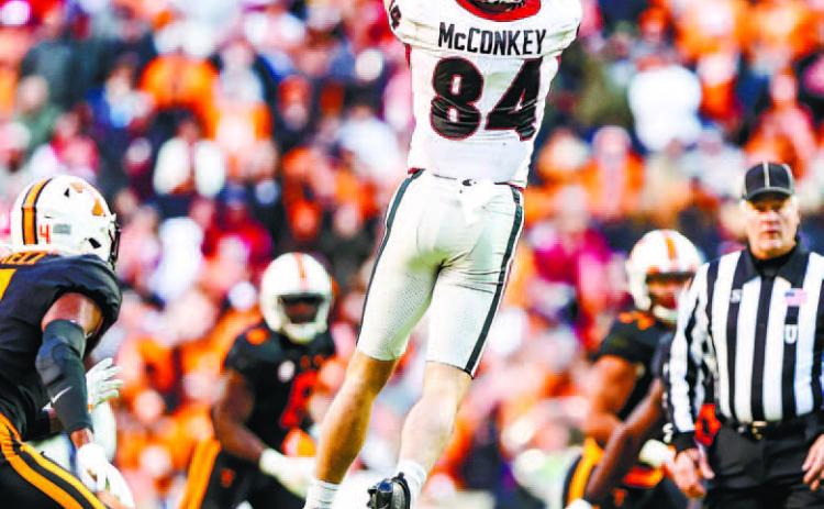 Wide receiver Ladd McConkey (84) goes up and makes a catch between multiple Tennessee defenders in last year’s game against the Volunteers. TONY WALSH/UGA Athletics