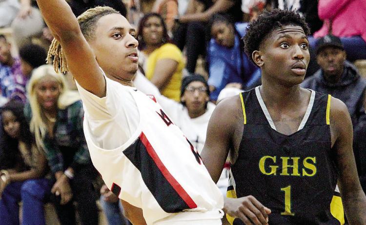 Baldwin’s Isaiah Dennis (left) contributed 12 points to a tight 56-53 win over Griffin last Friday. TREY NORRIS/Staff