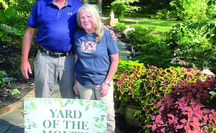 Ray and Cate Wells were honored by the Milledgeville Garden Club for their beautiful gardens as the August Yard of the Month. Since becoming the owners of their historic home 15 years ago, the couple has gradually transformed the extensive grounds into a series of gardens and architectural features. The pair plan to develop more spaces in the future. CONTRIBUTED
